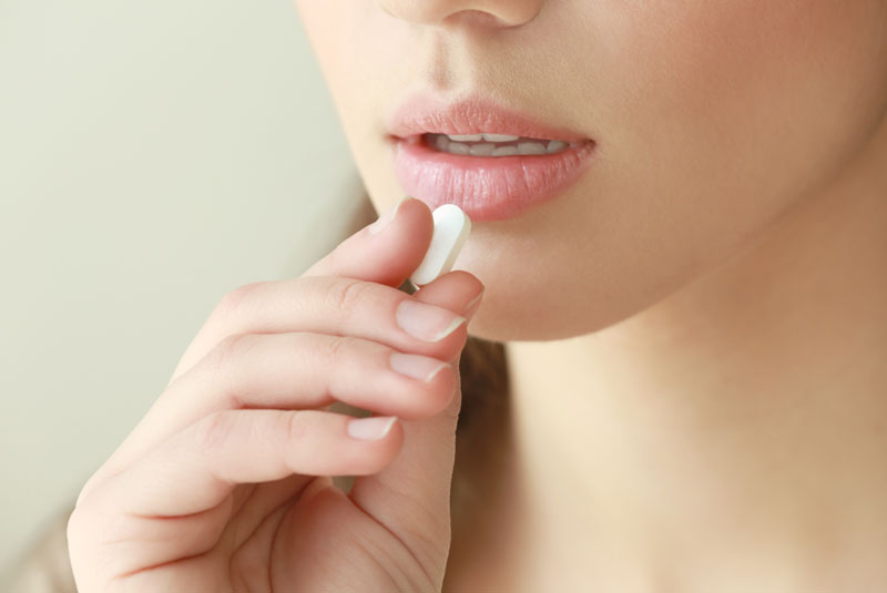 Dental Patient Taking Sedative Pill