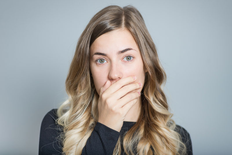 Dental Patient Hiding Her Teeth